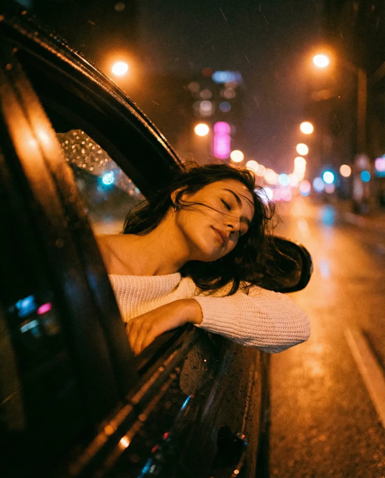 Young Woman Leaning Out of Car Window with Relaxed Expression