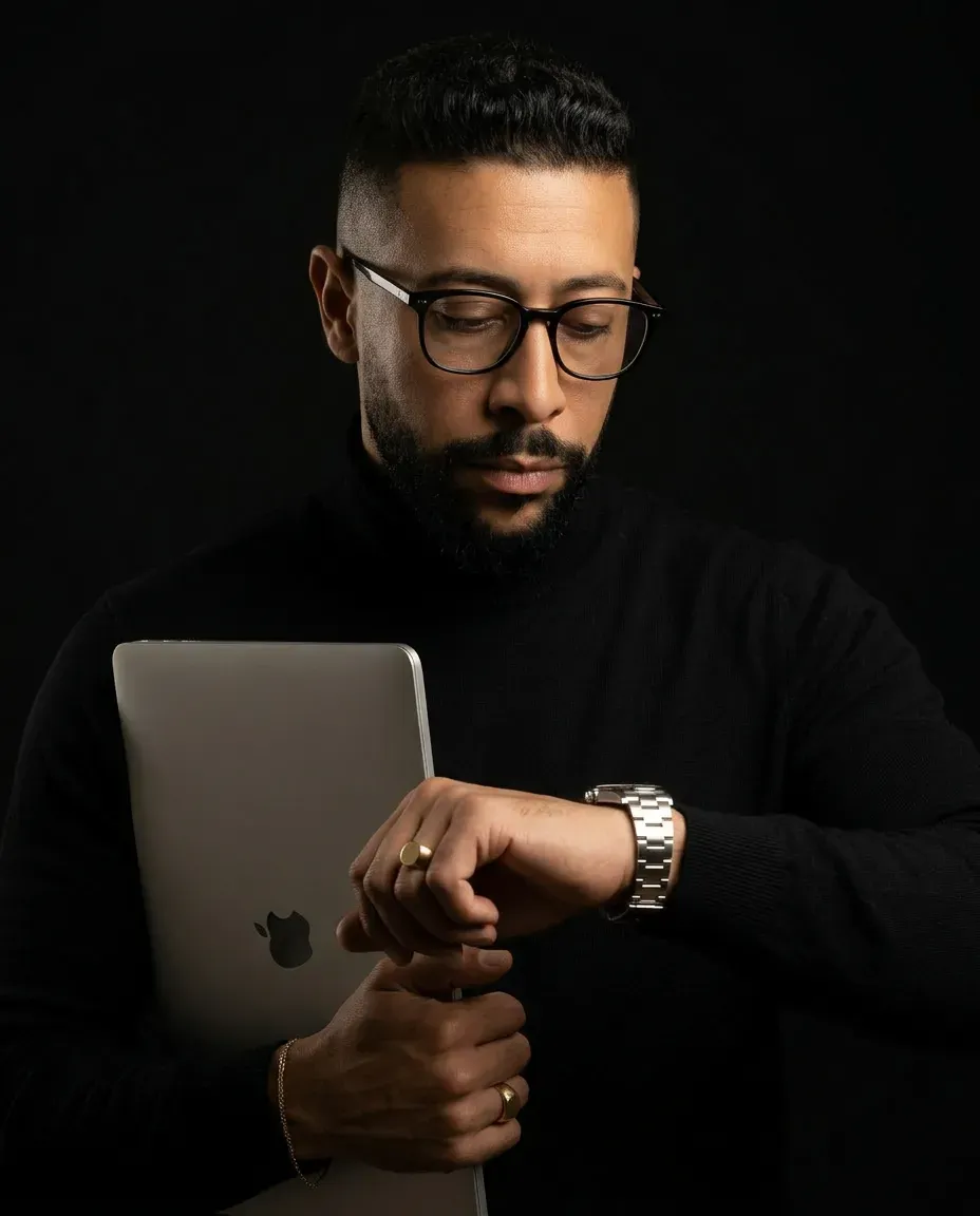Cinematic Studio Portrait Holding Laptop with Dramatic Lighting