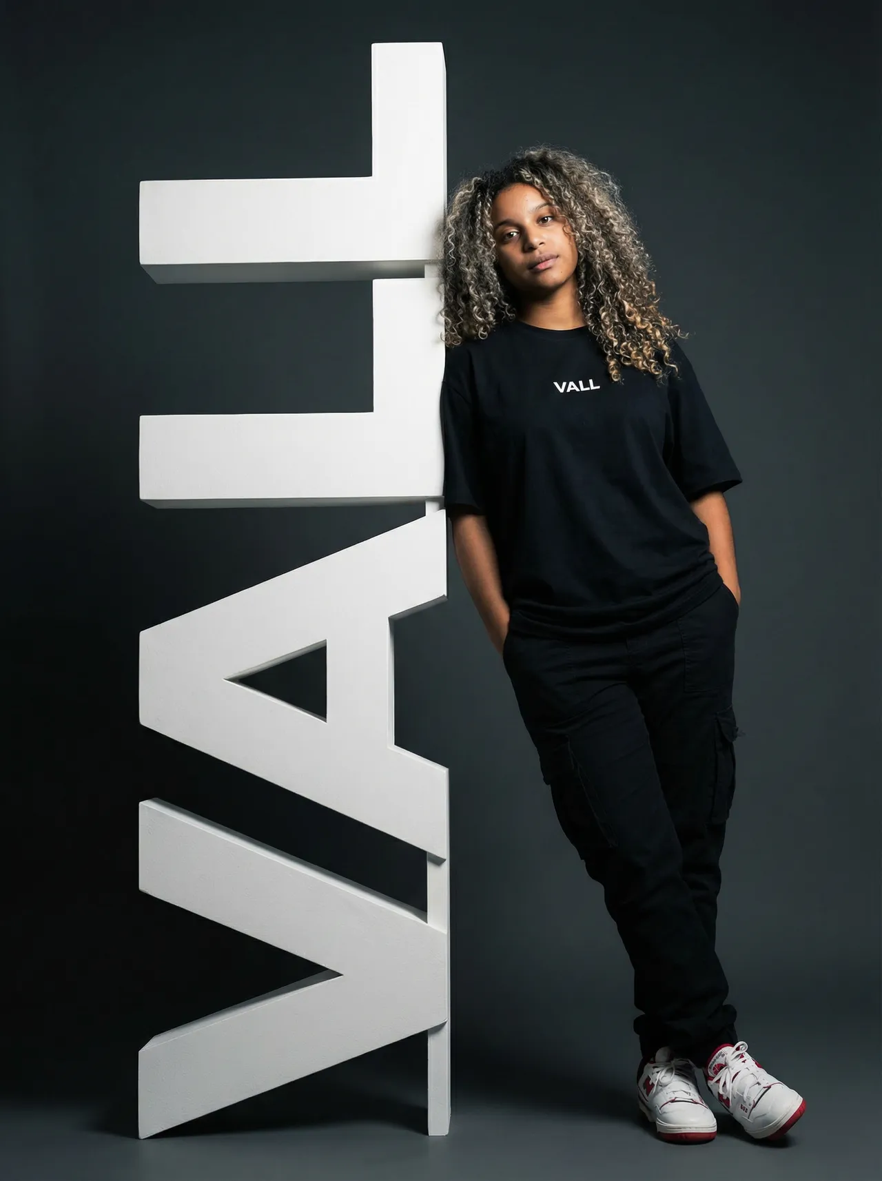 Ultra-Realistic Streetwear Portrait with Architectural Typography Sculpture