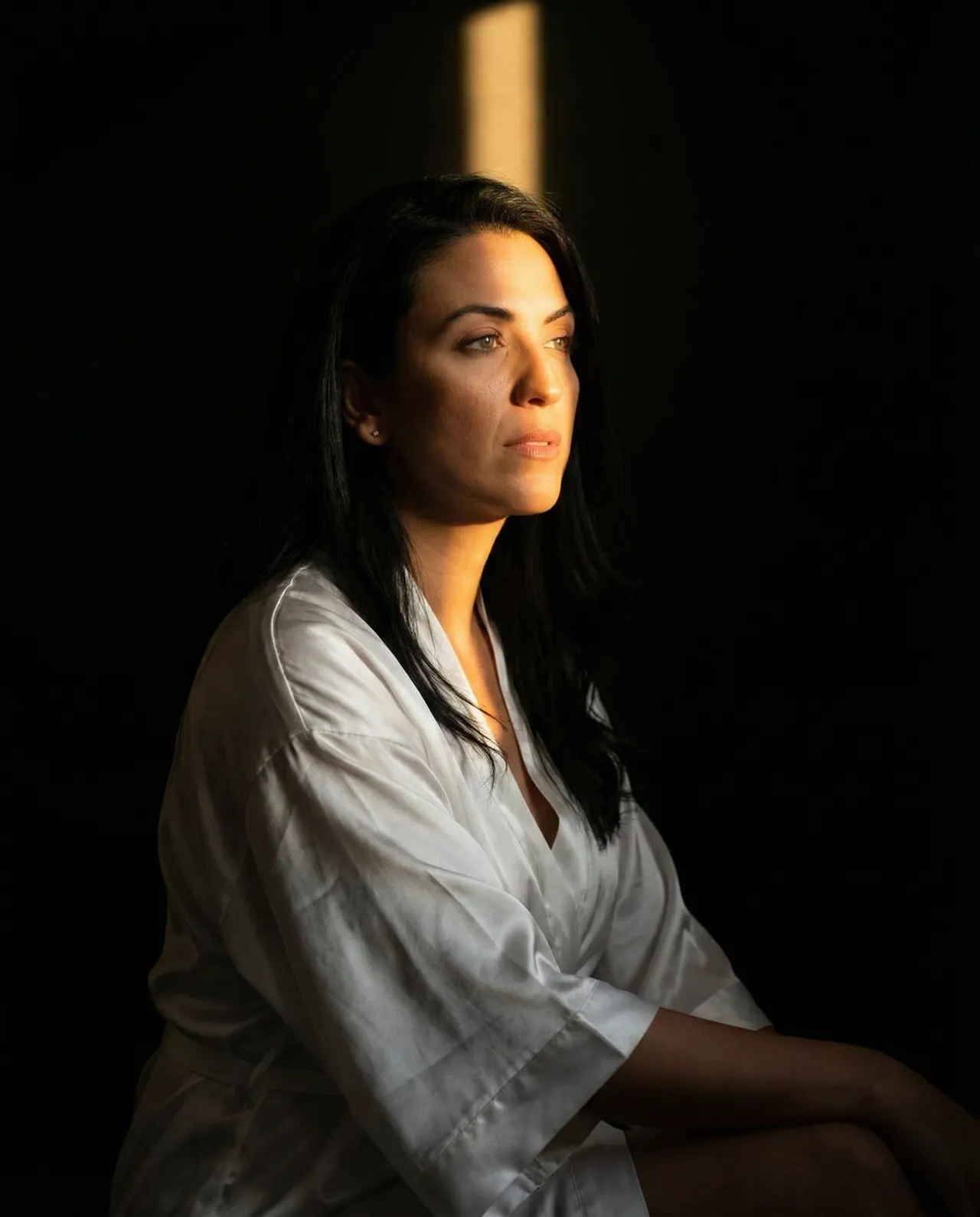 Chiaroscuro Intimate Portrait with Golden Beam and Sculpted Shadows