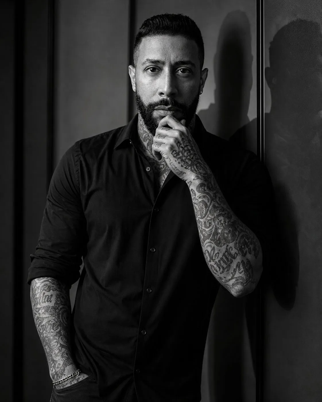 Cinematic Black-and-White Fashion Portrait of a Tattooed Man