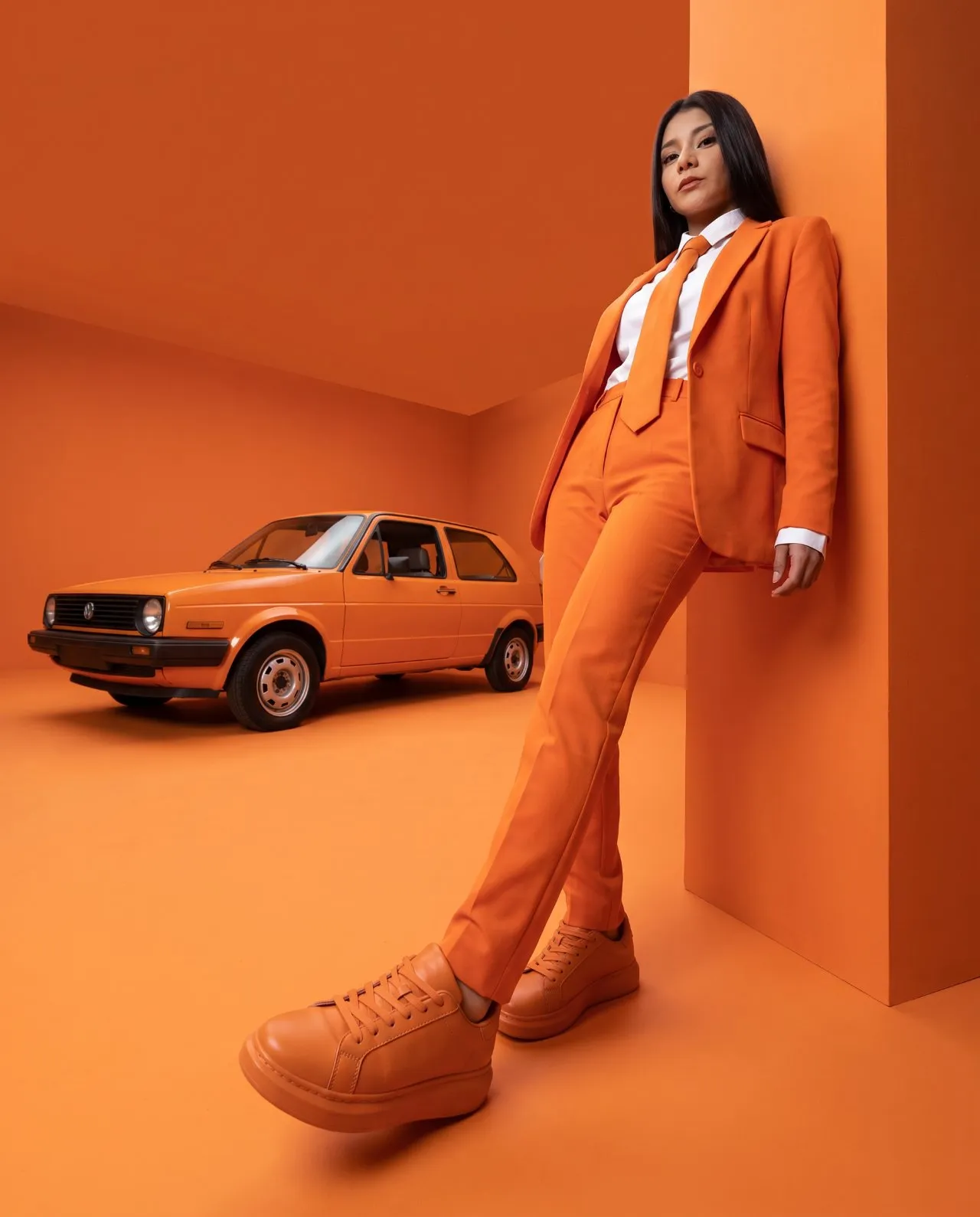 High-Fashion Monochrome Orange Editorial Portrait, Low-Angle 24mm