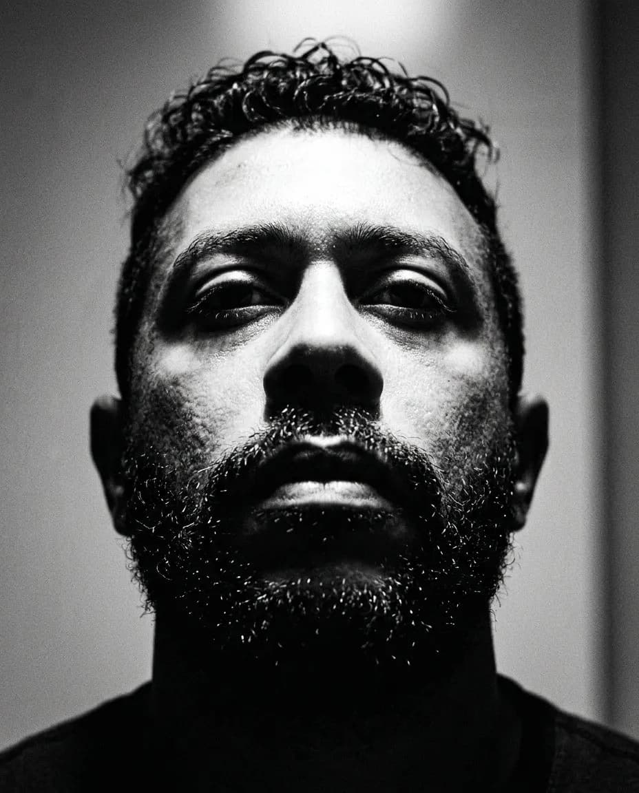 Cinematic Black-and-White Close-Up Portrait with Dramatic Top Lighting
